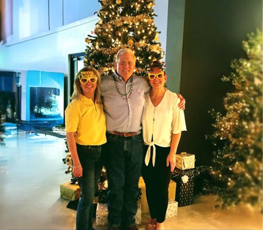 Hank Massey Jnr. (center) With Member Of The MCF Team