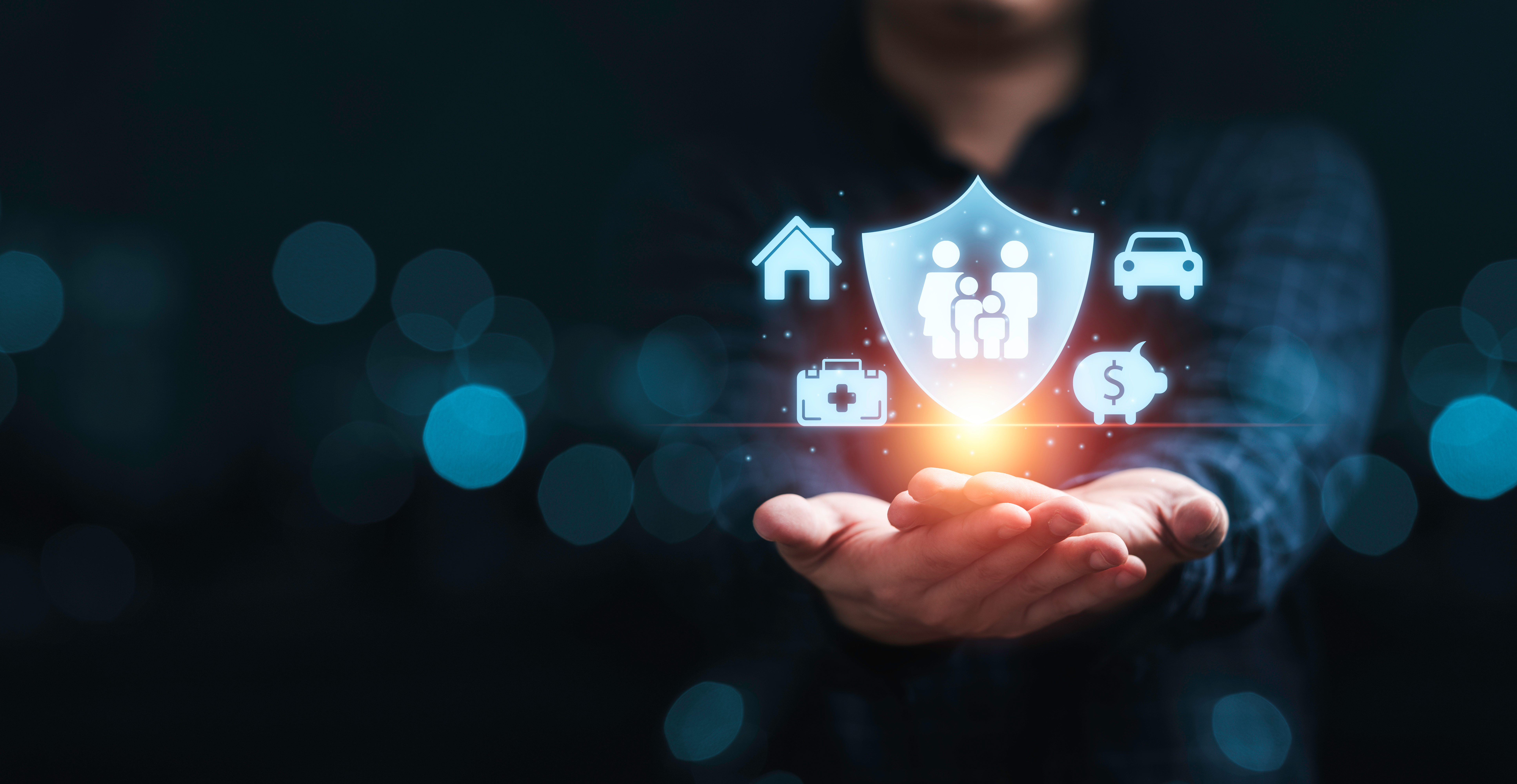 Hands Holding Icons Of Family, Health, Real Estate, Car And Financial Insurance